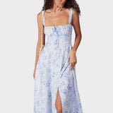 Renata | Midi mėlynas su gėlių raštu, kvadratiniais iškirpimais ir raukšlėmis